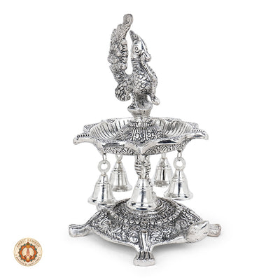 Silver Plated Peacock Diya with Tortoise Pedestal & Bells (25 cm)