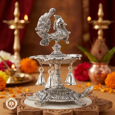 Silver Plated Peacock Diya with Tortoise Pedestal & Bells (25 cm)
